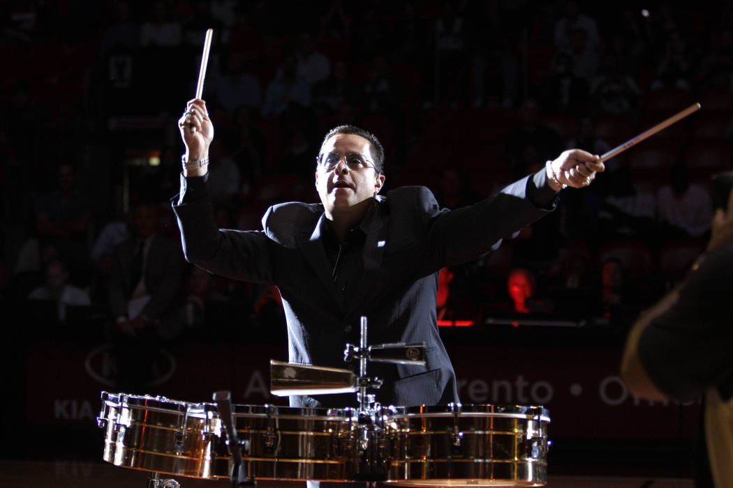 Tito Puente Jr. performs before an NBA basketball game between the Miami Heat and San Antonio S ...