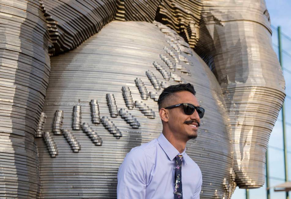 Artist Luis Varela-Rico with his sculpture "Organic Study No. 2" during a dedication ...