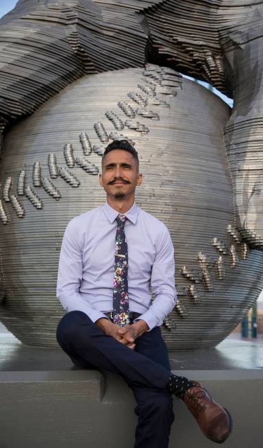 Artist Luis Varela-Rico with his sculpture "Organic Study No. 2" during a dedication ...