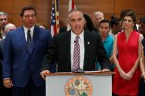 Andrew Pollack, center, father of Meadow Pollack, who was killed in the Parkland, Fla., school ...