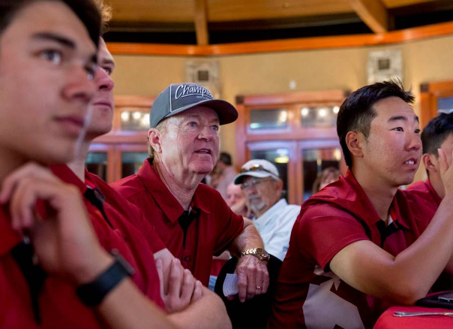 UNLV men's golf head choach Dwaine Knight, center, waits with his team to hear where they will ...