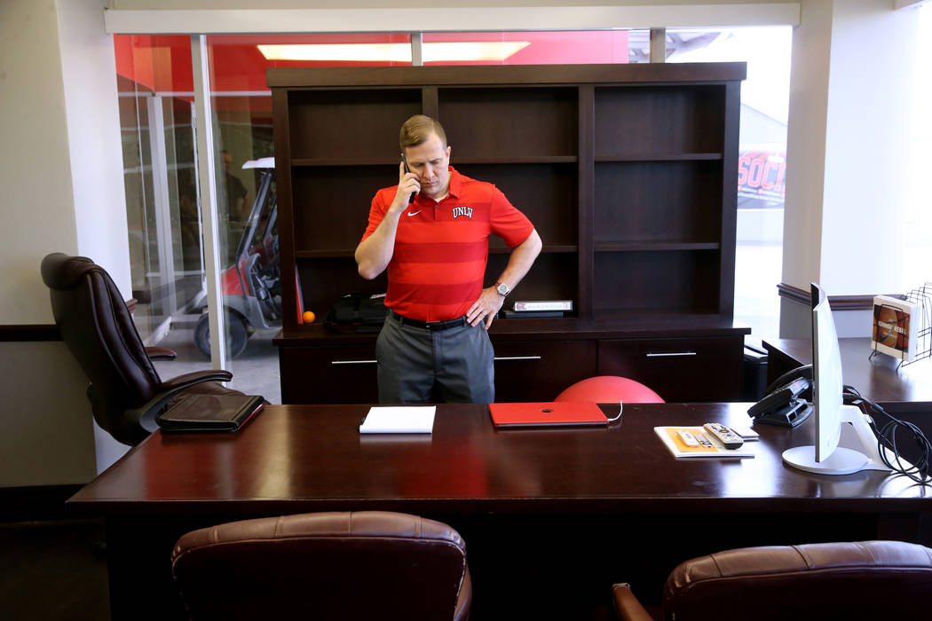 New UNLV basketball coach T.J. Otzelberger talks to a reporter in his office at the Thomas &amp ...