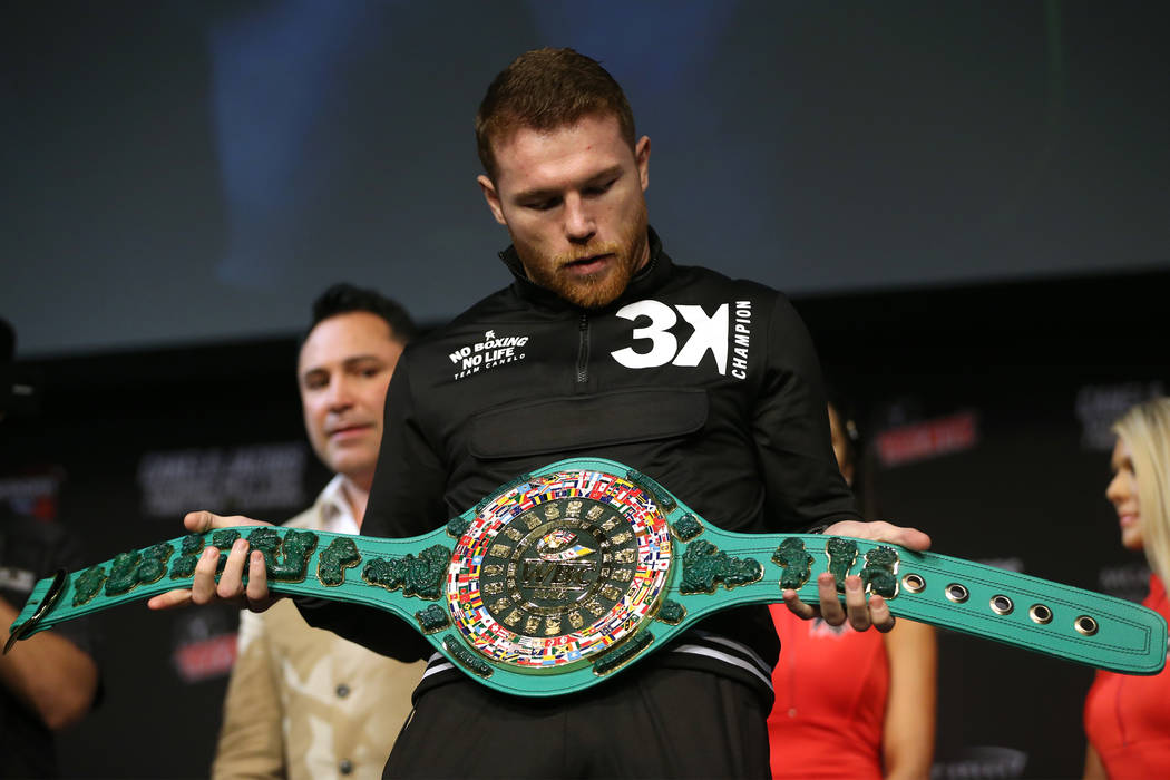 Saul "Canelo" Alvarez looks at a WBC belt made for the winner of his fight against Da ...