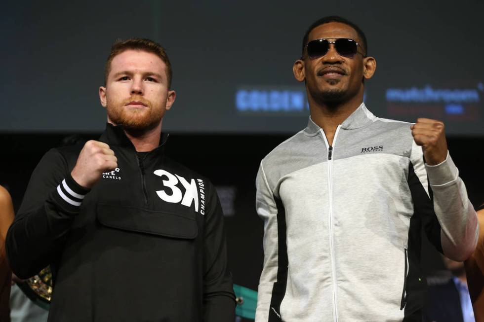 Saul "Canelo" Alvarez, left, and Daniel Jacobs, pose during a press conference at the ...