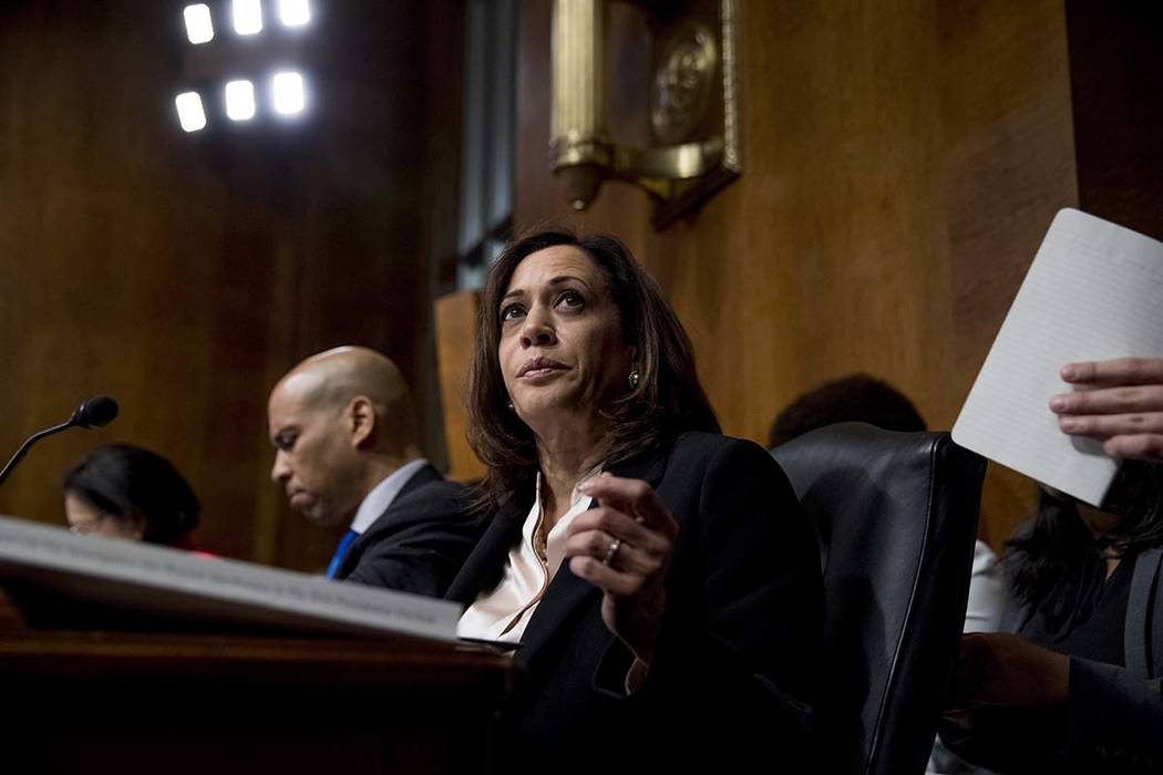 Democratic presidential candidates Sen. Cory Booker, D-N.J., left, and Sen. Kamala Harris, D-Ca ...