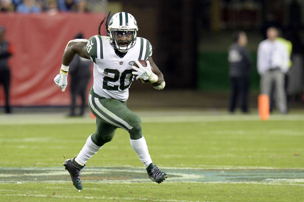 In this Dec. 2, 2018, file photo, New York Jets running back Isaiah Crowell carries the ball ag ...