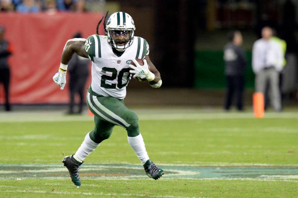 In this Dec. 2, 2018, file photo, New York Jets running back Isaiah Crowell carries the ball ag ...