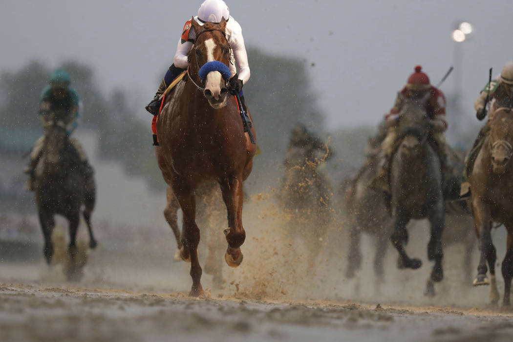 Mike Smith rides Justify to victory during the 144th running of the Kentucky Derby horse race a ...