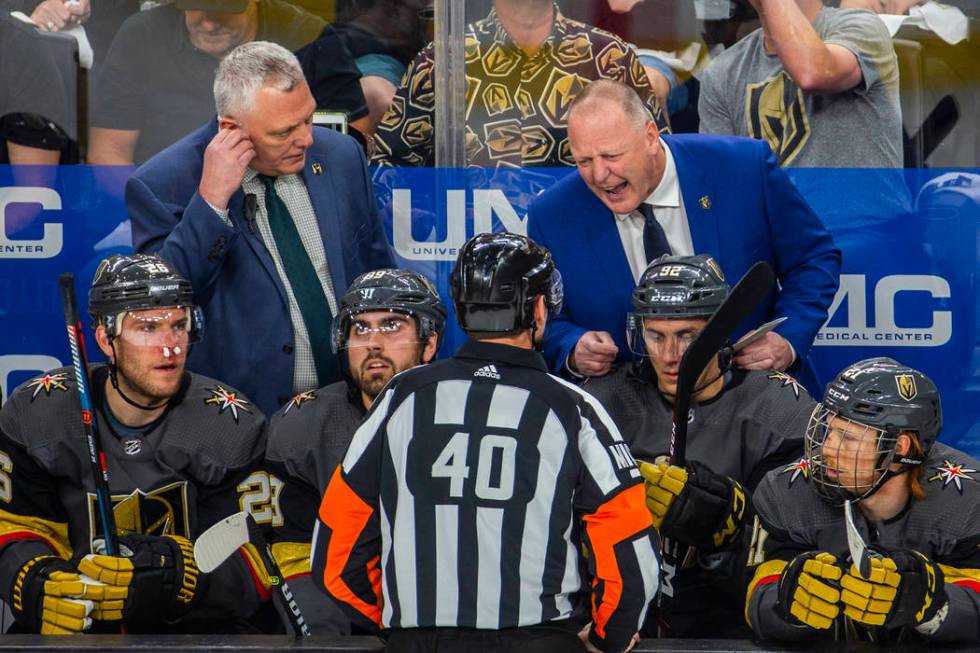 Golden Knights Head Coach Gerard Gallant argues a point with a referee during the first period ...