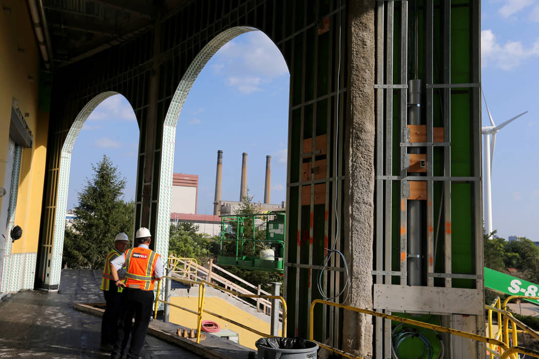 Greg John, executive director of brand marketing, left, gives a tour of outdoor terraces overlo ...