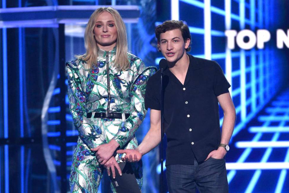 Sophie Turner, left, and Tye Sheridan present the award for top new artist at the Billboard Mus ...