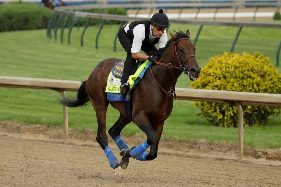 Kentucky Derby entrant Game Winner is ridden during a workout at Churchill Downs Wednesday, May ...