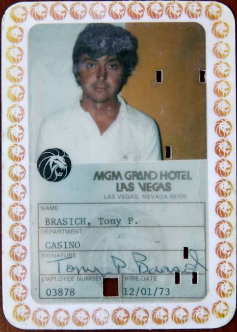 Anthony Brasich, 71, of Las Vegas shows his employee ID while waiting for his appointment at Co ...