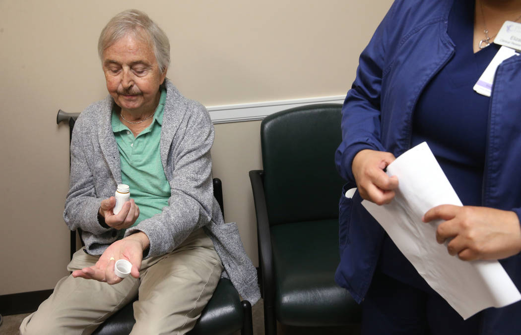 Anthony Brasich, 71, of Las Vegas prepares to take his dosage of a new cancer treatment at Comp ...