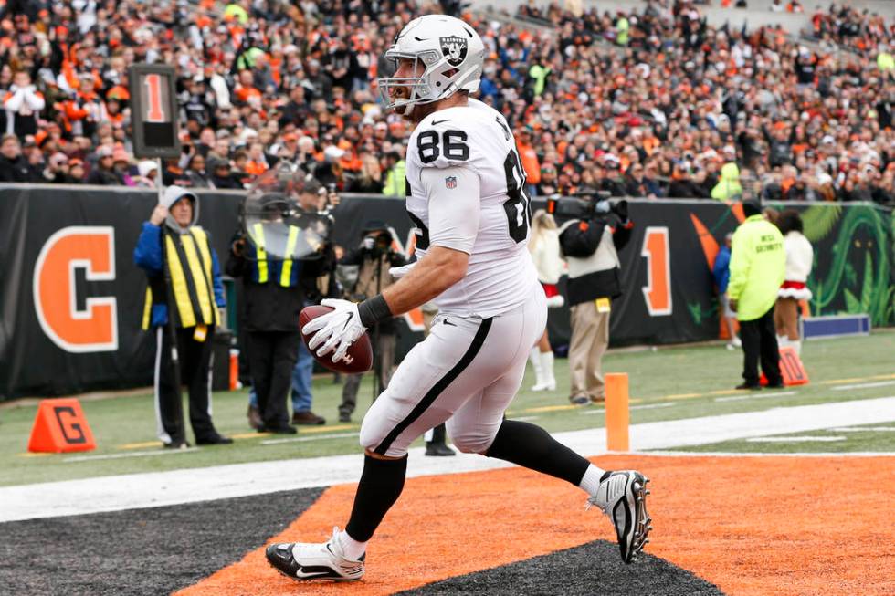 Oakland Raiders tight end Lee Smith scores a touchdown in the first half of an NFL football gam ...