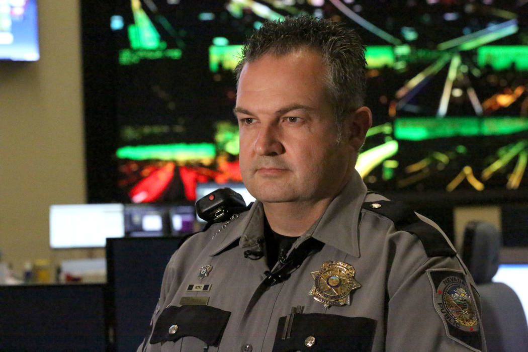 Nevada Highway Patrol Public Information Officer, Travis Smaka, briefs the media on an incident ...