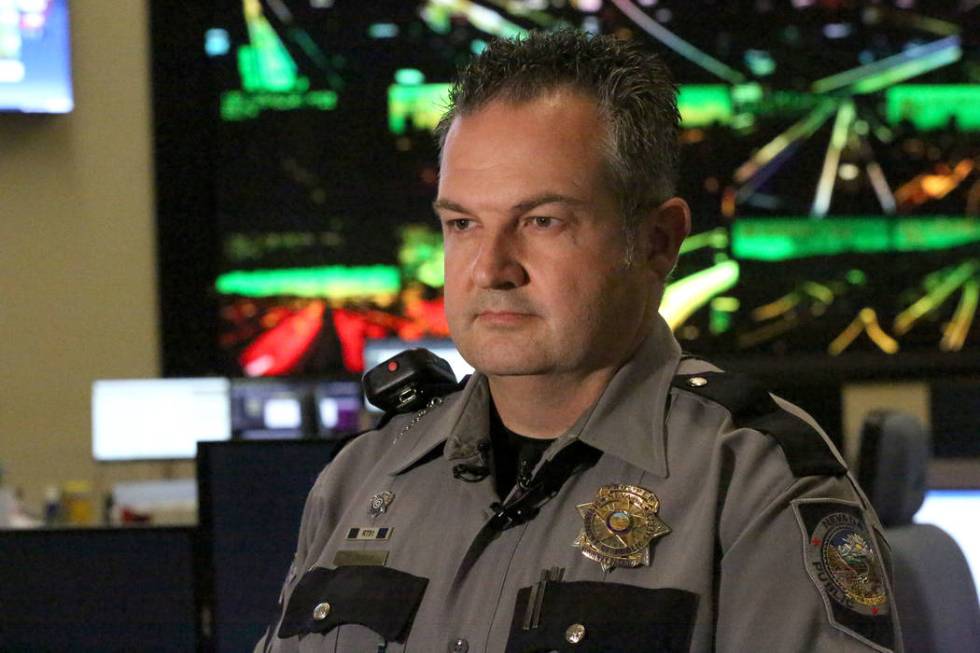 Nevada Highway Patrol Public Information Officer, Travis Smaka, briefs the media on an incident ...