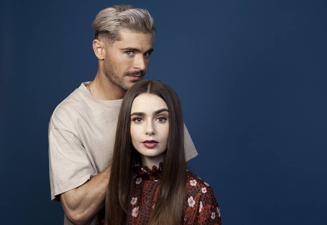 This April 22, 2019 photo shows Zac Efron, left, and Lily Collins posing for a portrait at the ...