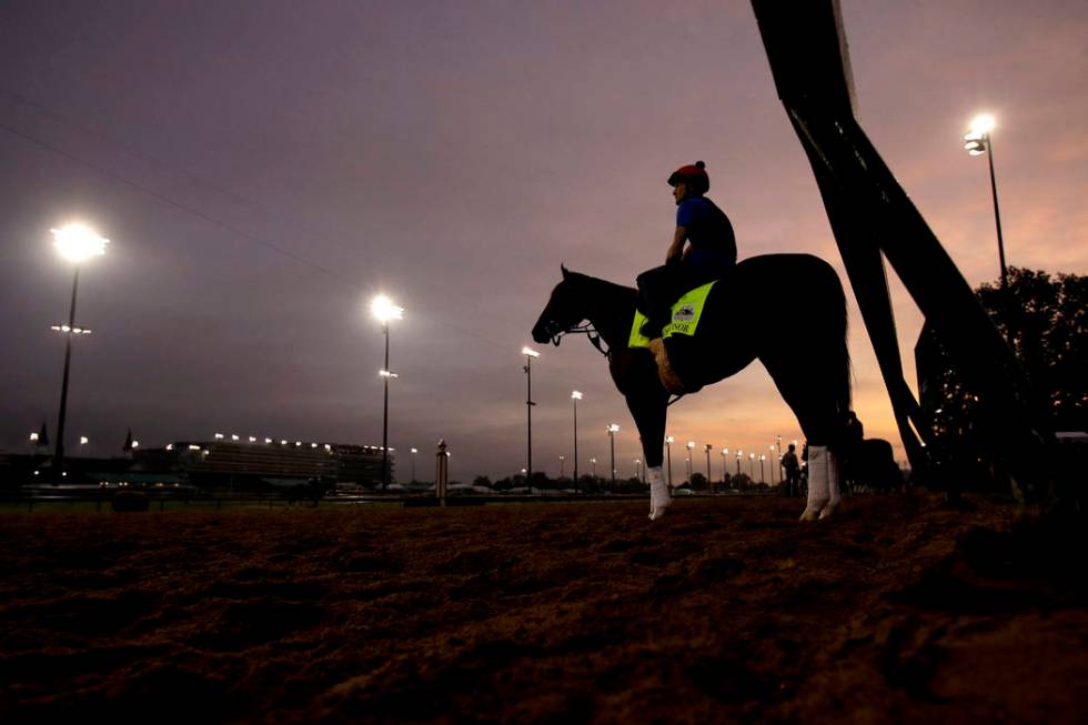 Kentucky Derby entrant Code of Honor waits on the track to workout at Churchill Downs Thursday, ...