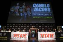 Boxing promoter Oscar De La Hoya, center, speaks during a press conference for the upcoming tit ...