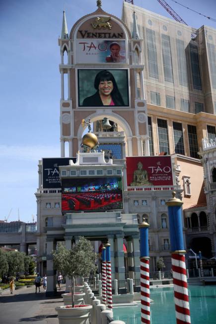 Portraits of founding employees are displayed on The Venetian marquee to celebrate the 20th ann ...