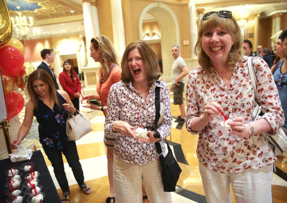 Liz Wilkinson, left, and Sally Evans of United Kingdom grab free gelato at The Venetian to cele ...