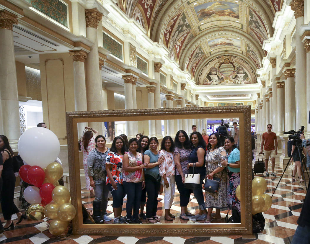 Friends pose in the Grand Colonnade at The Venetian to celebrate the 20th anniversary of the La ...