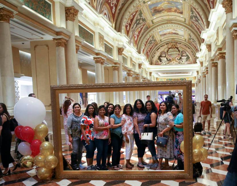 Friends pose in the Grand Colonnade at The Venetian to celebrate the 20th anniversary of the La ...