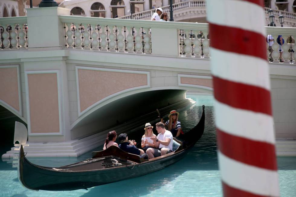 Shannon Terhaar and Layne Chapman of Minneapolis applaud gondolier Coco The Venetian to celebra ...