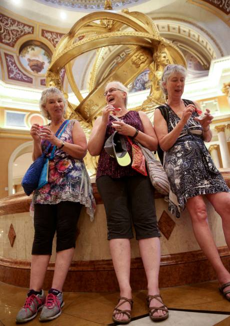 Margaret Kardelis, from left, Elizabeth Klassen and Marianne Stone of Canada eat free gelato at ...