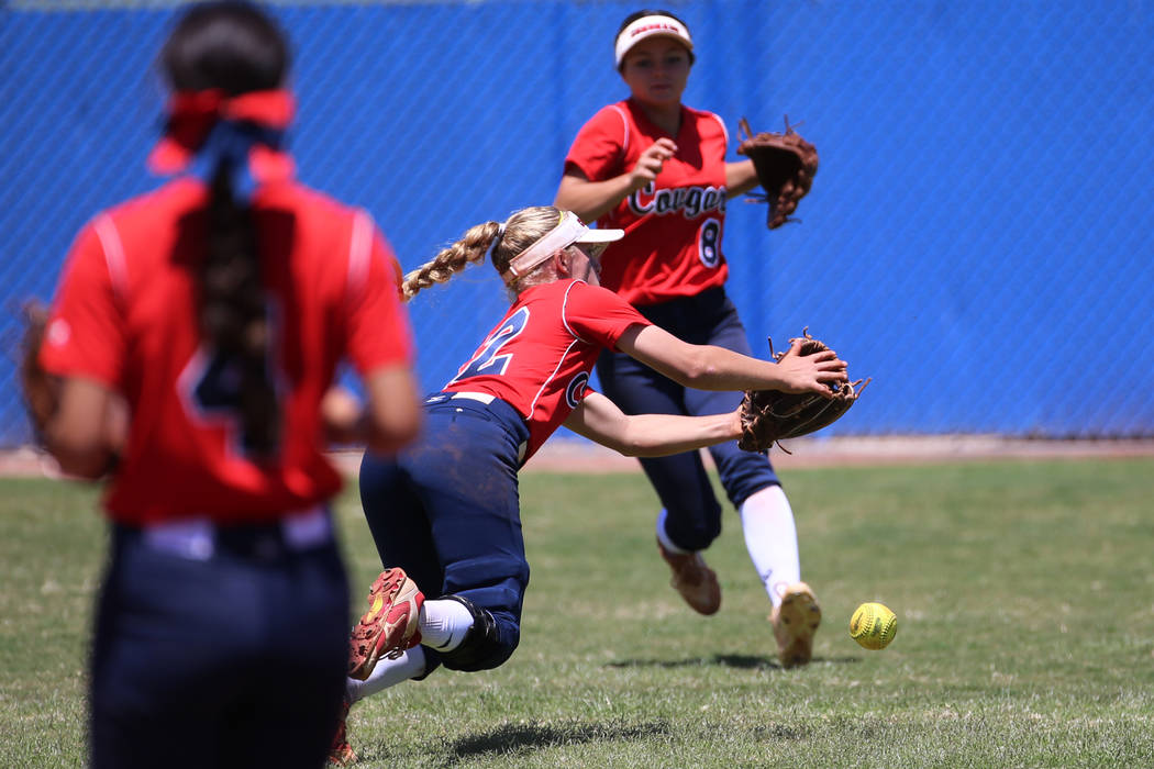 Coronado's Paige Sinicki (12) misses the ball in the outfield as her teammate Madison Stephens ...
