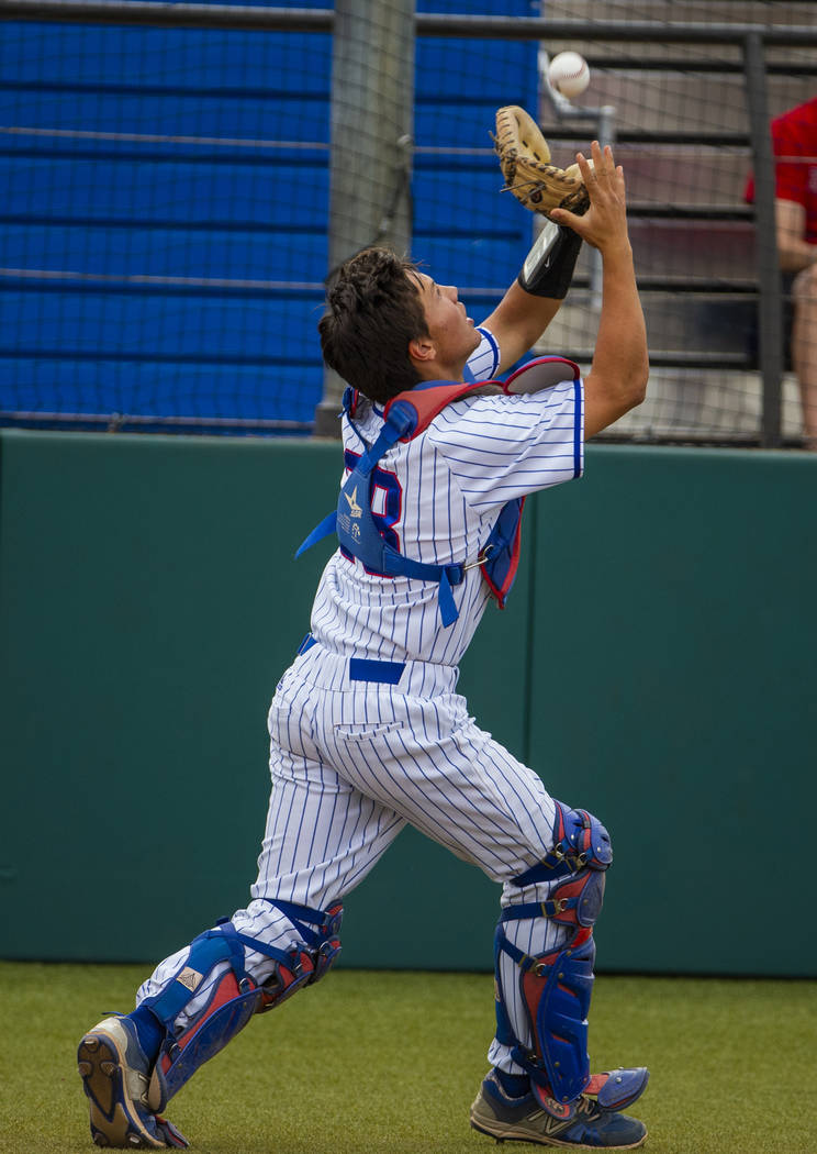 Reno catcher Lane Oliphant (28) pulls in an infield fly ball versus Las Vegas during their stat ...