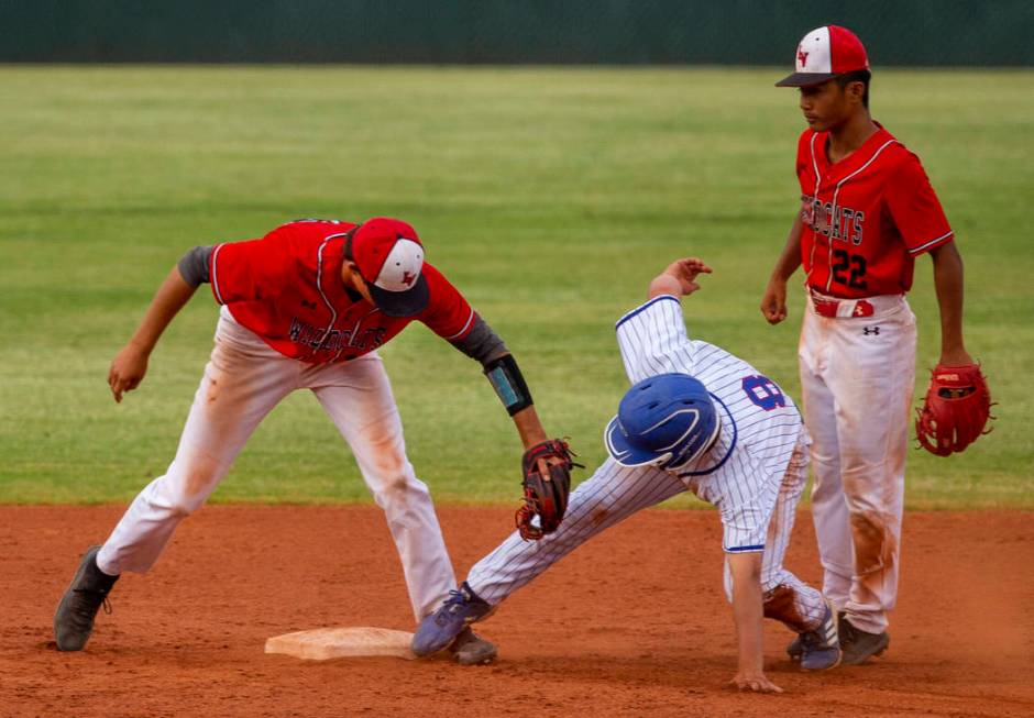 Las Vegas' Nathan Freimuth (12) tags out Reno's Gunner Gouldsmith (8) who misses the base and g ...