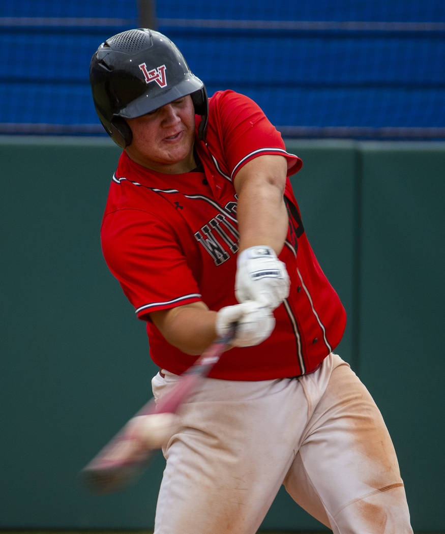 Las Vegas' Trevor Johnson (20) connects on a hit versus Reno during their state baseball tourna ...