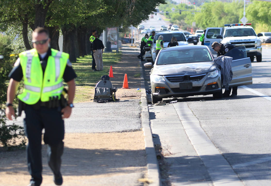 Henderson police investigate after a man in a motorized wheelchair was hit by a vehicle at Boul ...