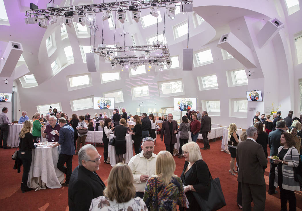 Guests fill the Cleveland Clinic Lou Ruvo Center for Brain Health for a reading and book signin ...