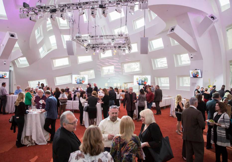 Guests fill the Cleveland Clinic Lou Ruvo Center for Brain Health for a reading and book signin ...