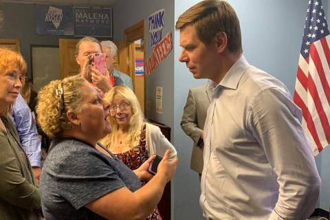 California Rep. Eric Swalwell speaks to an audience member after addressing a gathering of Wash ...