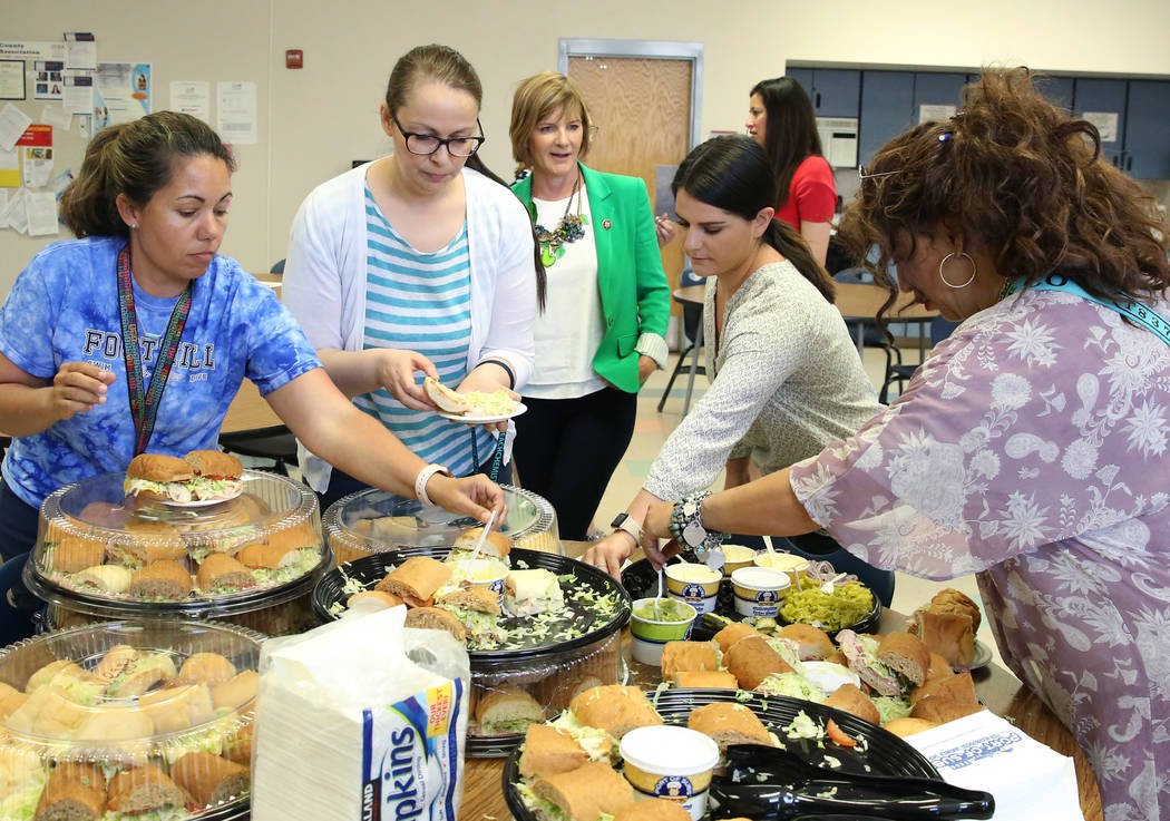 Rep. Susie Lee, D-Nev., center, chats with teachers after delivering lunch on Monday, May 6, 20 ...