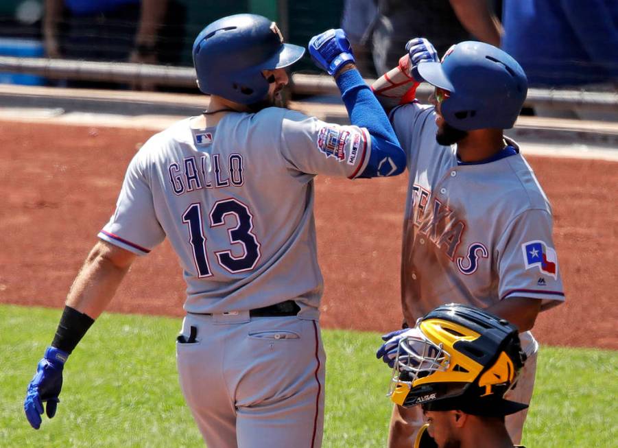 Texas Rangers' Joey Gallo (13) celebrates with Elvis Andrus after hitting a two-run home run of ...