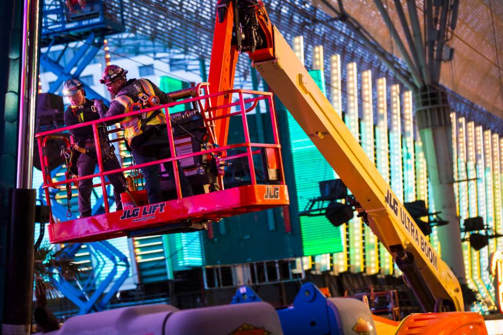 Construction use a lift during the second day of renovations of the Viva Vision canopy along th ...