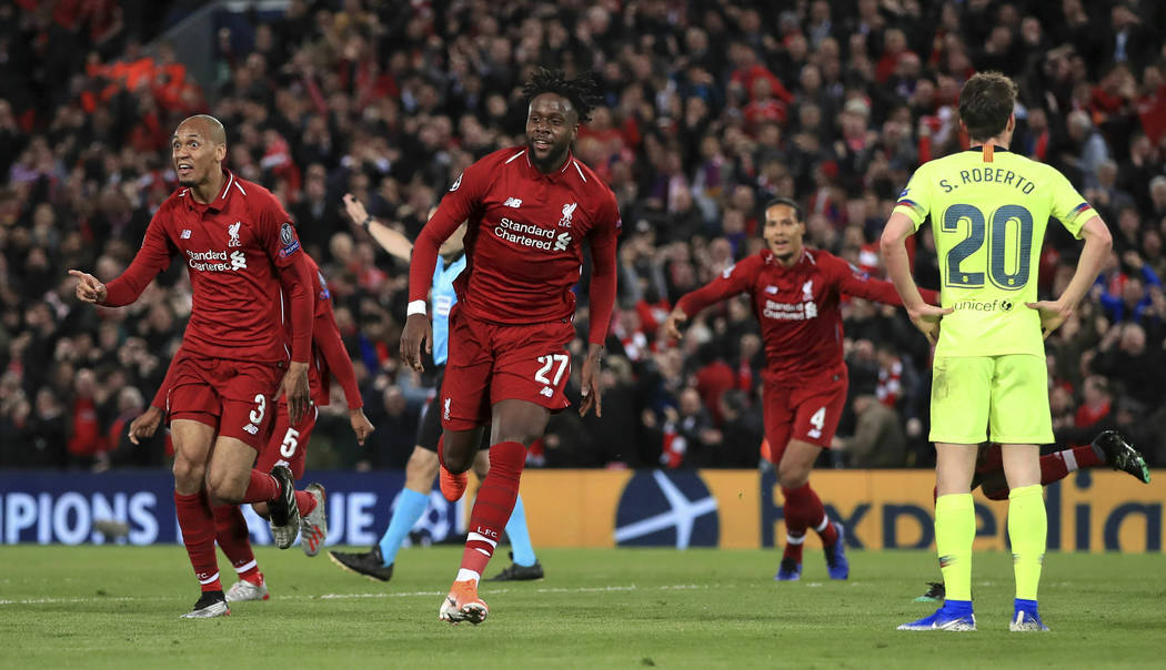 Liverpool's Divock Origi, center, celebrates scoring his side's fourth goal of the game during ...