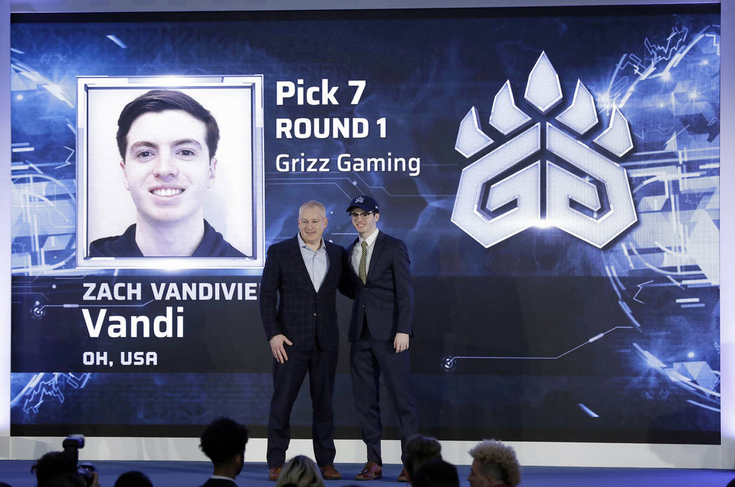 Brendan Donohue, managing director of the new NBA 2K esports league, left, poses for photograph ...