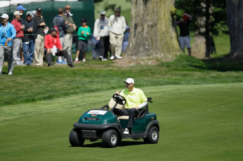 FILE - In this June 15, 2012, file photo, Casey Martin drives to the fifth green during the sec ...