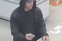 Las Vegas police are asking for help finding a man suspected of robbing a business at gunpoint ...