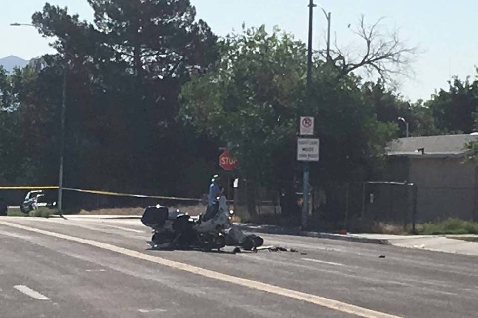 A Las Vegas motorcycle officer suffered minor injuries when a driver he had stopped for a traff ...