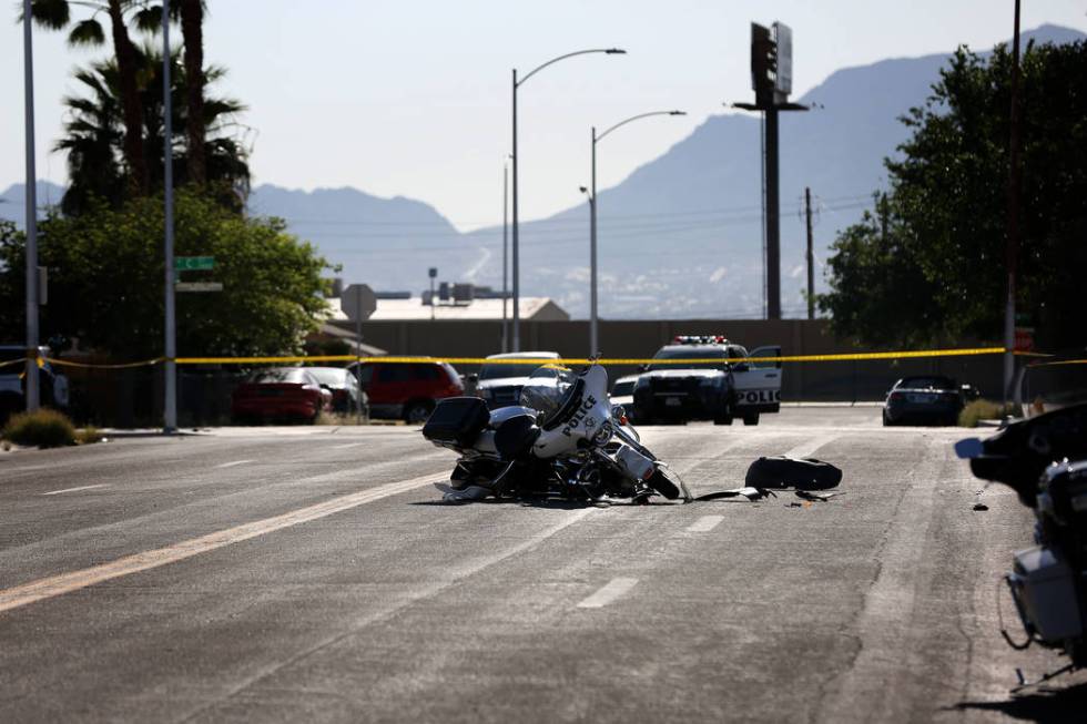 A Las Vegas motorcycle officer suffered minor injuries when a driver he had stopped for a traff ...