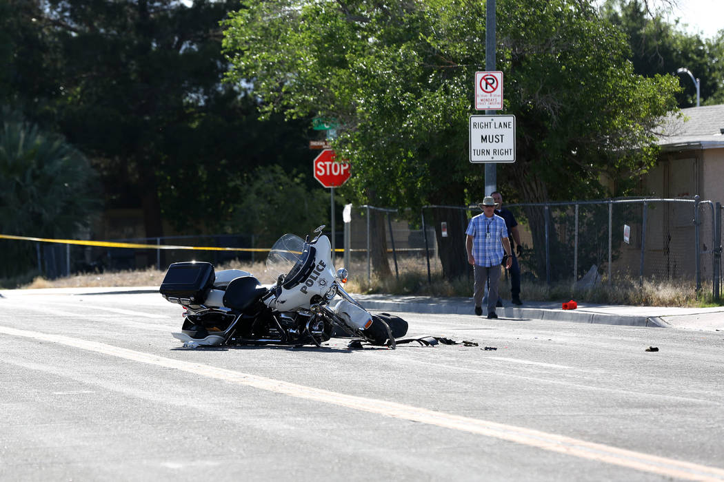 A Las Vegas motorcycle officer suffered minor injuries when a driver he had stopped for a traff ...