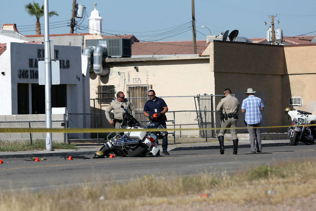 A Las Vegas motorcycle officer suffered minor injuries when a driver he had stopped for a traff ...