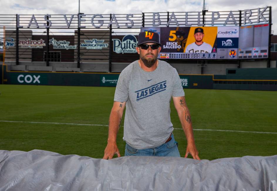 The Aviators head groundskeeper Collin Doebler with their new field tarp at Las Vegas Ballpark, ...